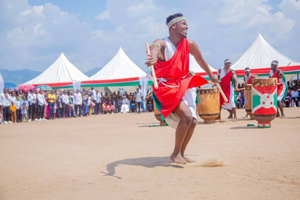 Vibrant cultural festival with traditional dancers performing in colorful attire outdoors.